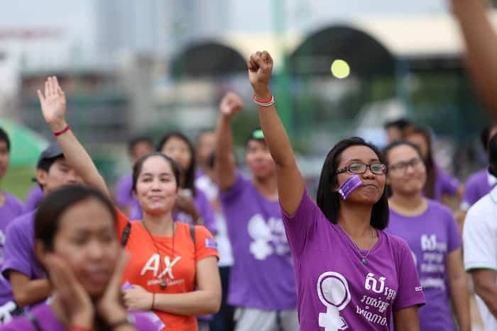Women with a her fist raised in protest